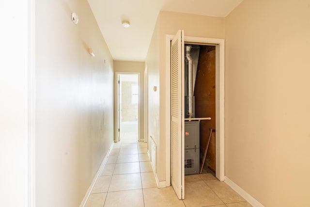 corridor with light tile patterned floors