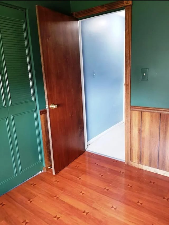 unfurnished room with light wood-type flooring