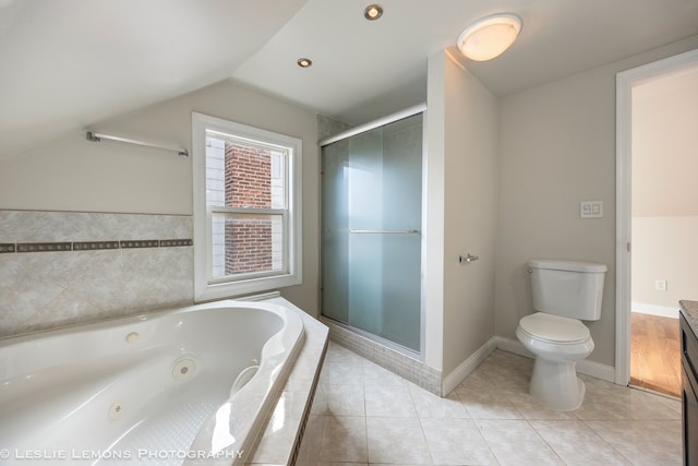 full bathroom with lofted ceiling, tile patterned flooring, separate shower and tub, vanity, and toilet