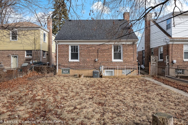 back of property featuring central AC unit