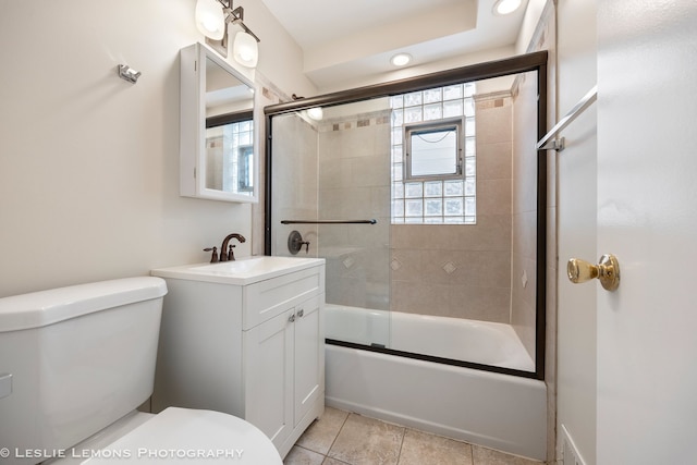 full bathroom with vanity, tile patterned flooring, enclosed tub / shower combo, and toilet