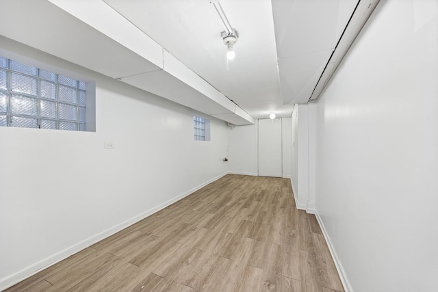 basement with light wood-type flooring