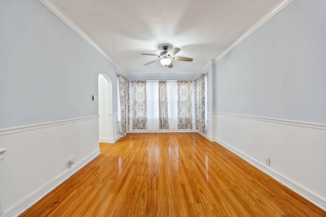 unfurnished room featuring ornamental molding, ceiling fan, and light wood-type flooring