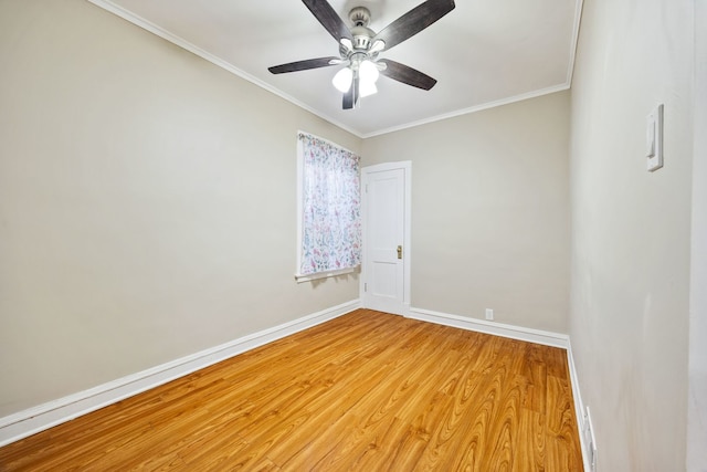 empty room featuring crown molding, ceiling fan, and hardwood / wood-style floors