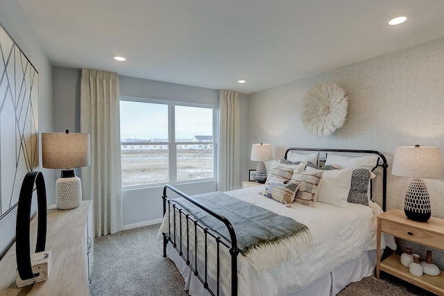 bedroom featuring light colored carpet