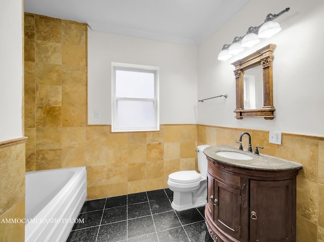 bathroom featuring tile patterned floors, wainscoting, a washtub, and tile walls