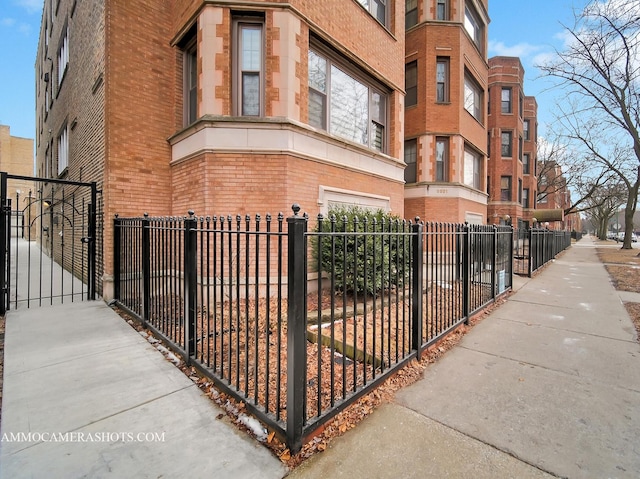 view of building exterior with a fenced front yard