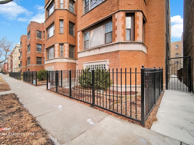 view of property featuring a fenced front yard and a garage