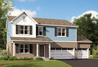 view of front of property featuring a garage and a front yard