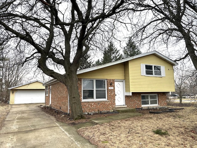 tri-level home with an outbuilding and a garage