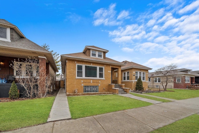 bungalow-style house featuring a shingled roof, brick siding, and a front lawn