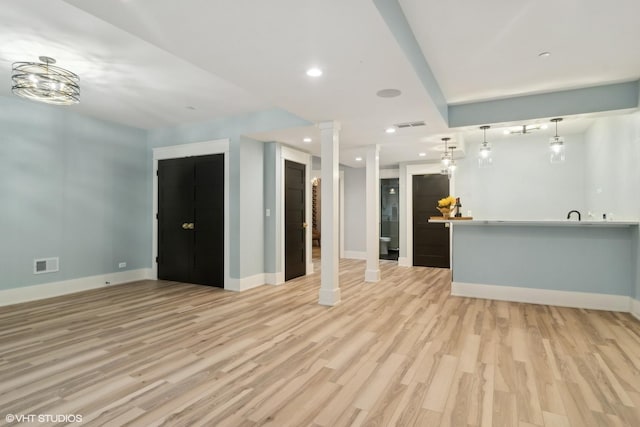 unfurnished living room featuring light hardwood / wood-style flooring