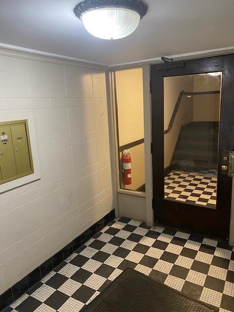 basement with mail boxes