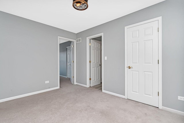 unfurnished bedroom with light carpet