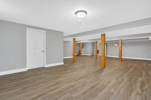 basement with hardwood / wood-style flooring