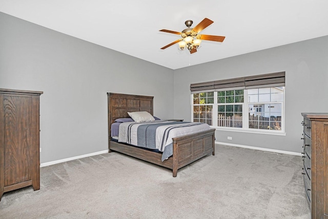 bedroom with ceiling fan and carpet floors