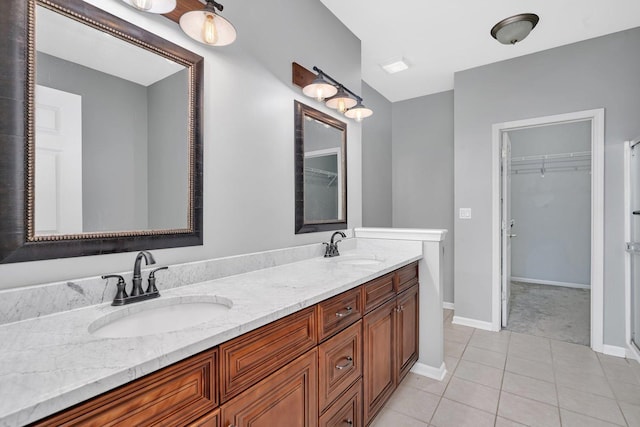 bathroom featuring tile patterned flooring and vanity