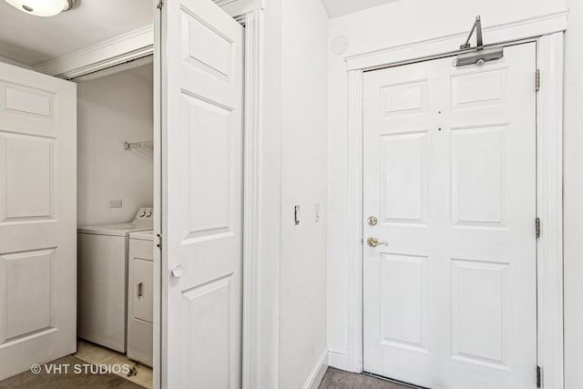 laundry area featuring baseboards and independent washer and dryer