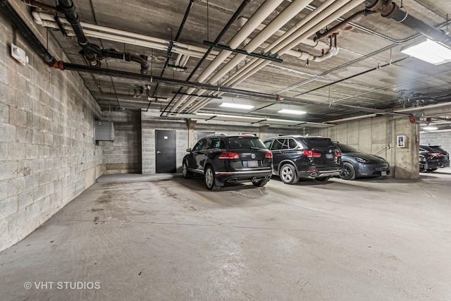 parking garage featuring concrete block wall