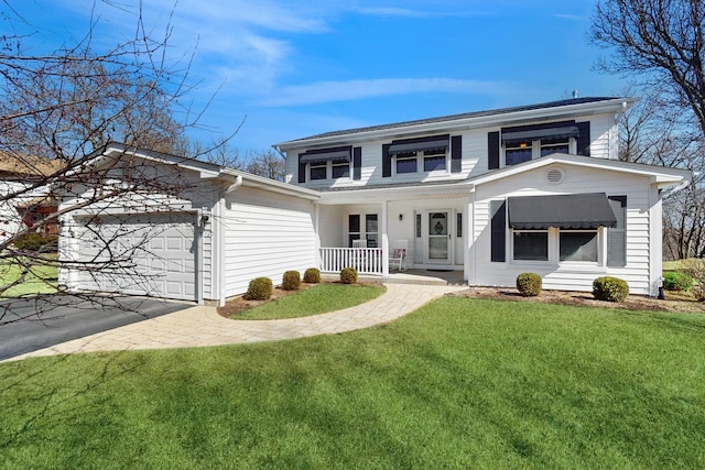 view of front of property featuring a porch, an attached garage, driveway, and a front lawn