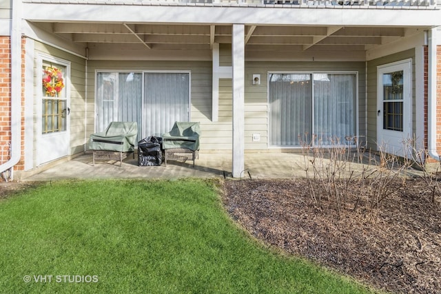 back of house featuring a yard and a patio area