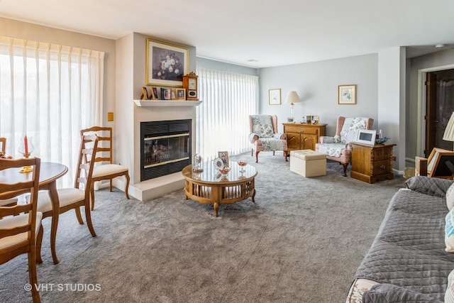 living room with plenty of natural light and carpet flooring