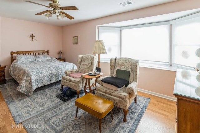 bedroom featuring ceiling fan and light hardwood / wood-style floors