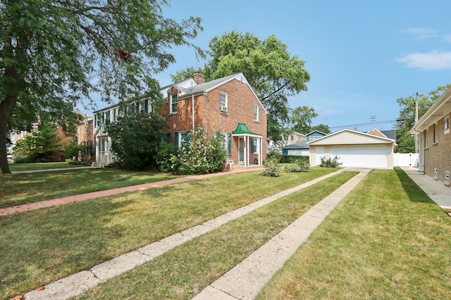 exterior space with a detached garage, brick siding, a chimney, and a lawn