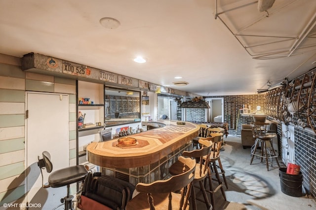 dining area featuring concrete floors