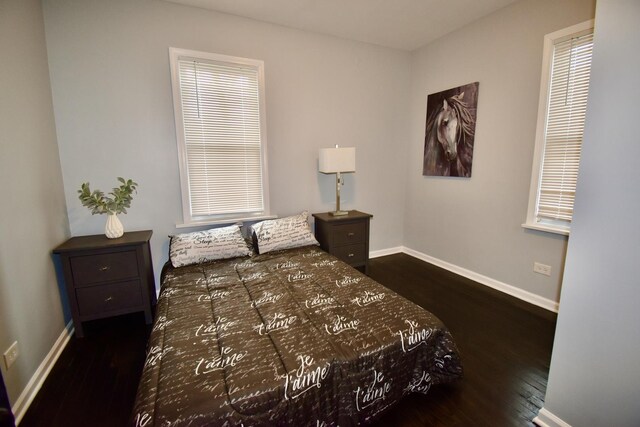 bedroom featuring dark wood-type flooring