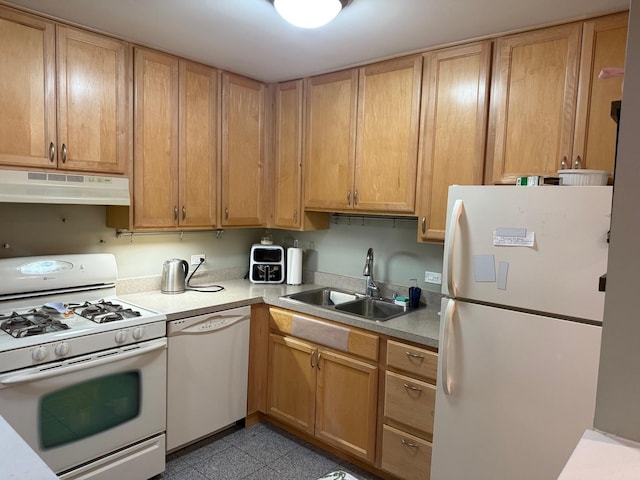 kitchen featuring sink and white appliances