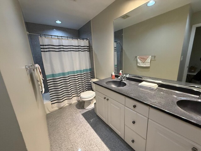 full bathroom with toilet, vanity, and shower / bathtub combination with curtain