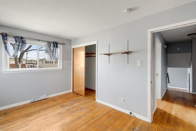 170 N Normandy Dr, Chicago Heights, IL 60411 - unfurnished bedroom with light hardwood / wood-style floors and a closet