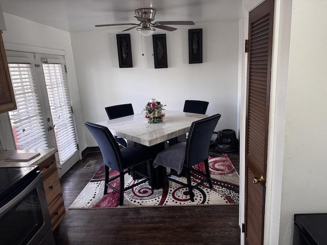 dining area featuring dark wood-type flooring, french doors, and ceiling fan