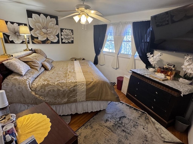 bedroom featuring ceiling fan and hardwood / wood-style floors