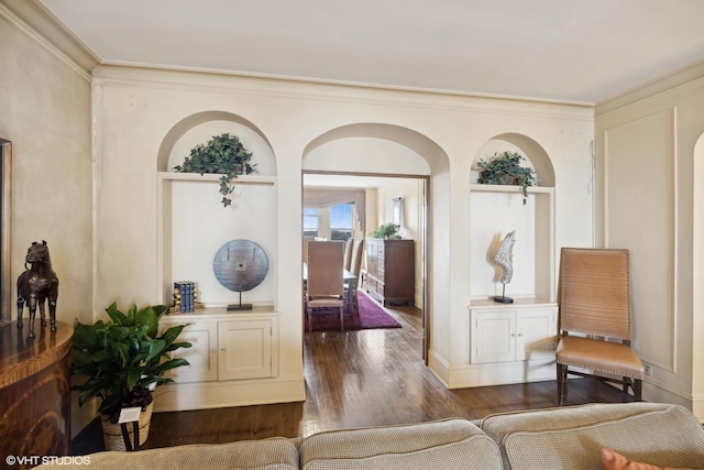 interior space featuring crown molding and dark hardwood / wood-style flooring