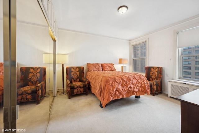 bedroom featuring ornamental molding, carpet, and radiator