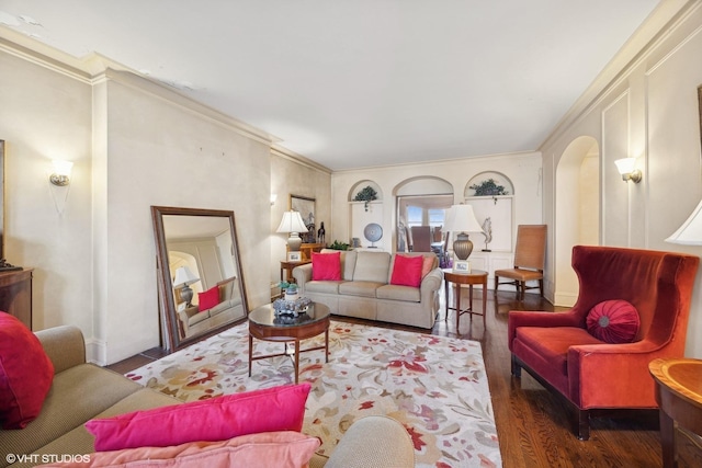 living room with crown molding and dark hardwood / wood-style flooring