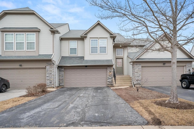 multi unit property featuring a garage