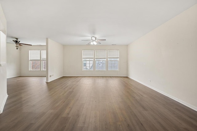 spare room with ceiling fan and dark hardwood / wood-style flooring