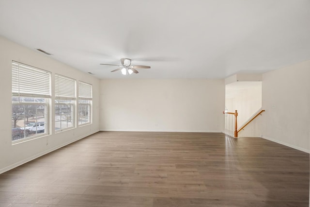 spare room with wood-type flooring and ceiling fan