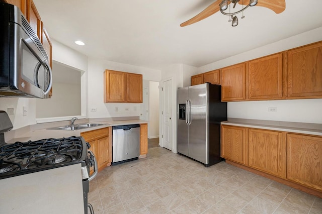 kitchen with sink, stainless steel appliances, and ceiling fan