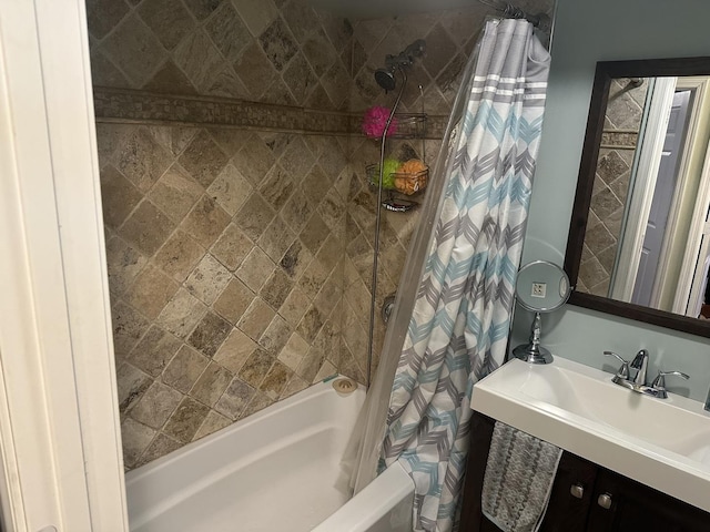 bathroom featuring sink and shower / bath combo with shower curtain