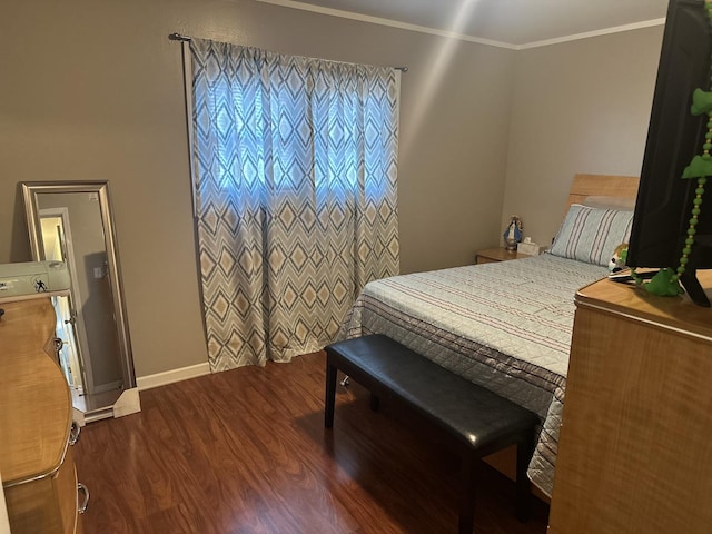 bedroom featuring ornamental molding and dark hardwood / wood-style flooring