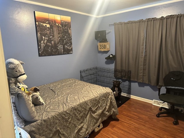 bedroom with hardwood / wood-style floors