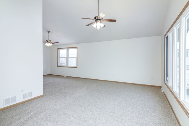 spare room featuring ceiling fan, carpet flooring, and high vaulted ceiling