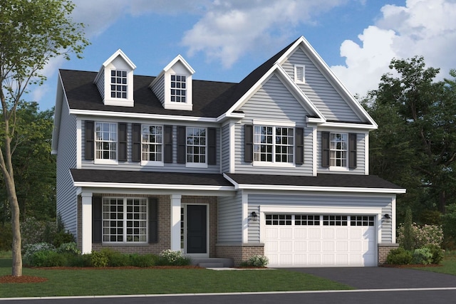 view of front of home featuring a garage and a front lawn