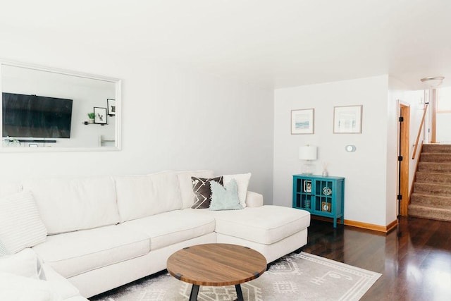 living room with dark hardwood / wood-style flooring