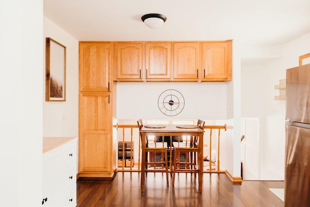 dining space with dark wood-type flooring