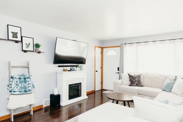 living room featuring dark hardwood / wood-style flooring